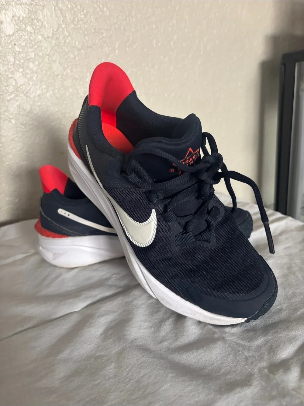 Nike Boys Sneakers in Black with White Swoosh and Red Accent